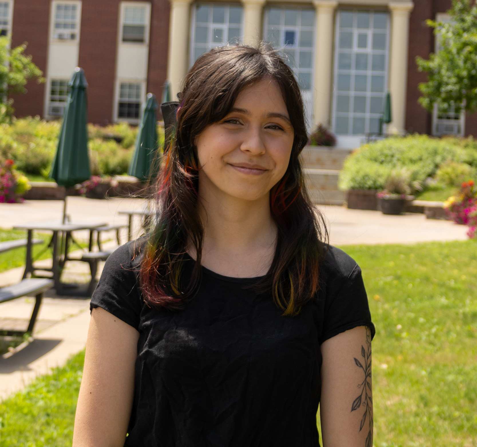 STUdent Ellie Namit standing on campus in the summer