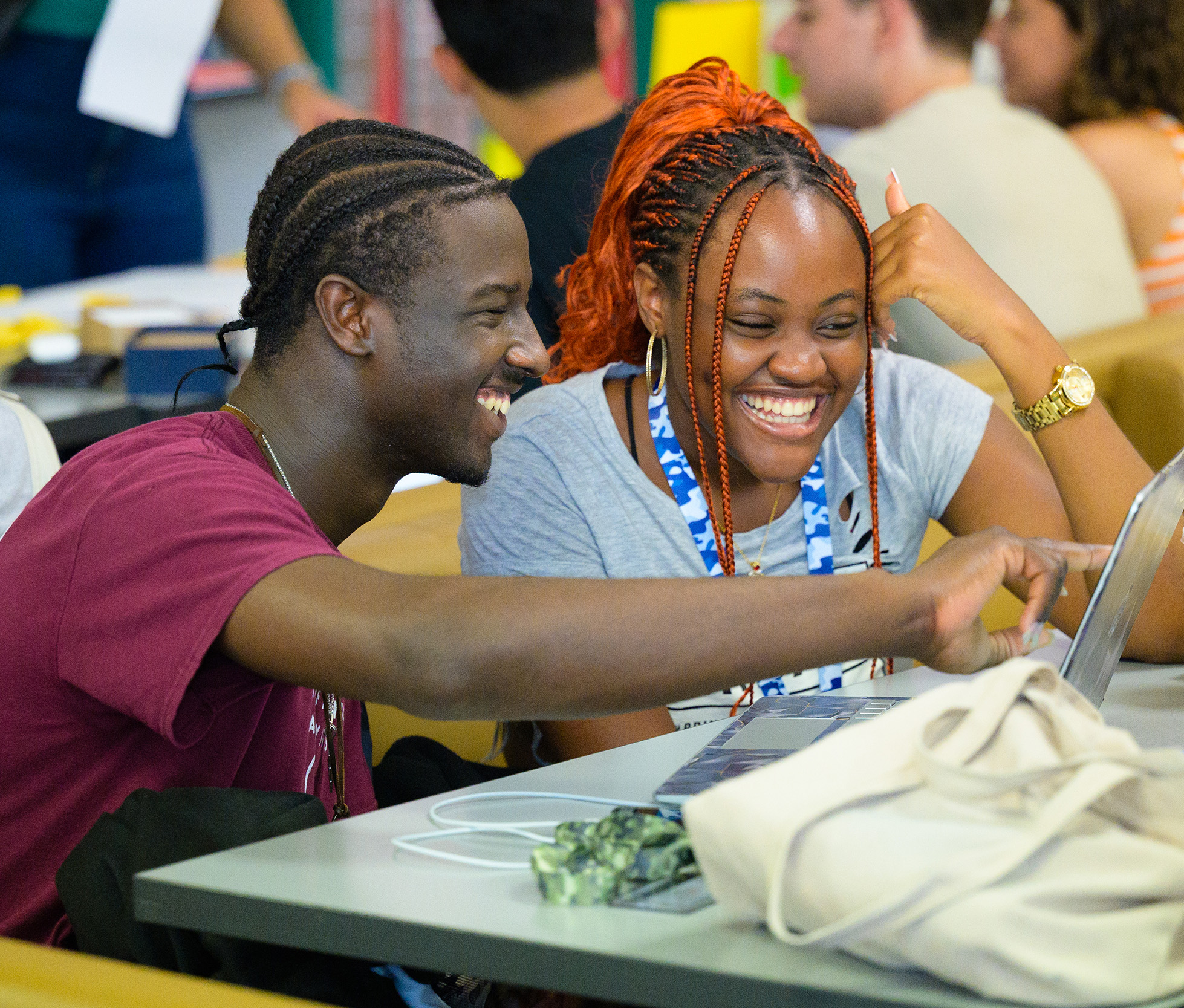 Two students looking at a laptop in Sir James Dunn Hall