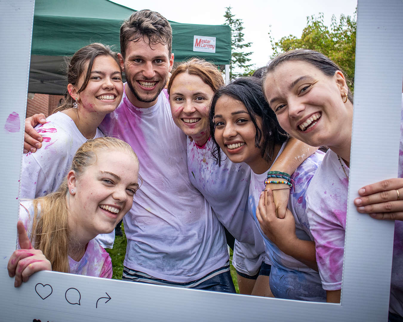 Students paint fight smiling