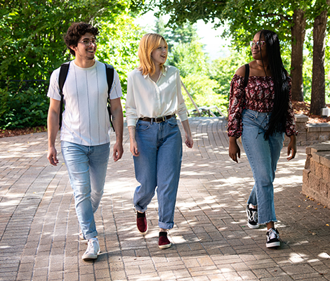 Three students walking together on campus