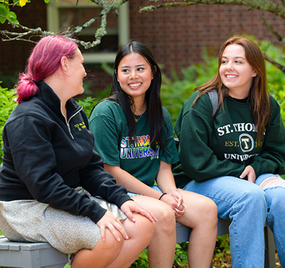 students sitting on campus