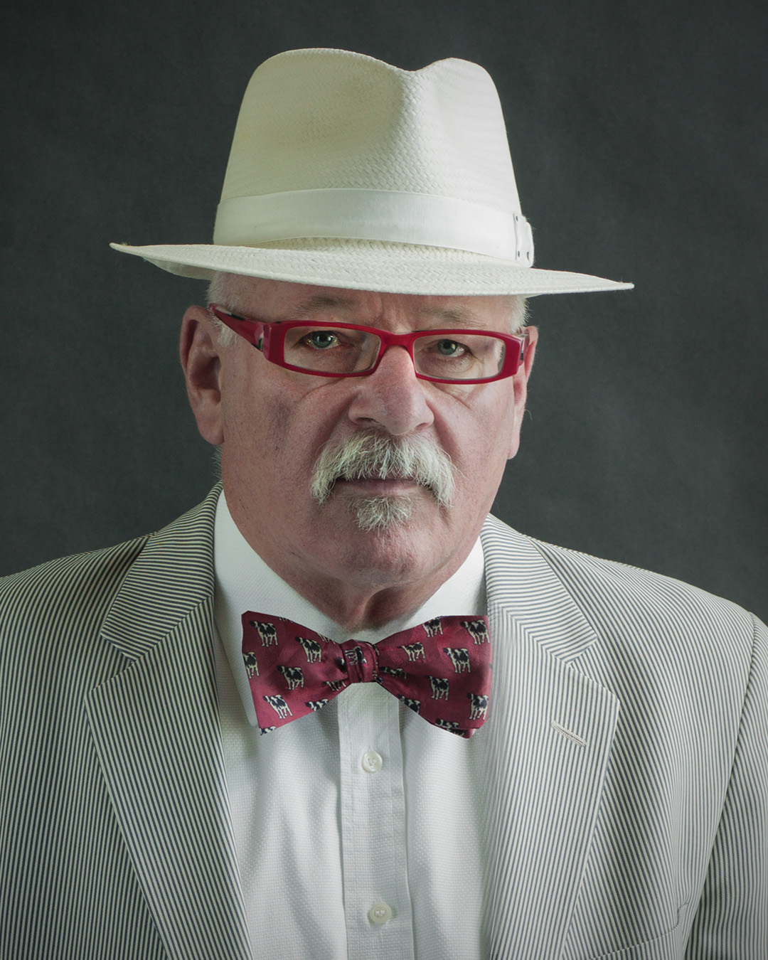 David Lutz is pictured wearing a red bow tie and white top hat.