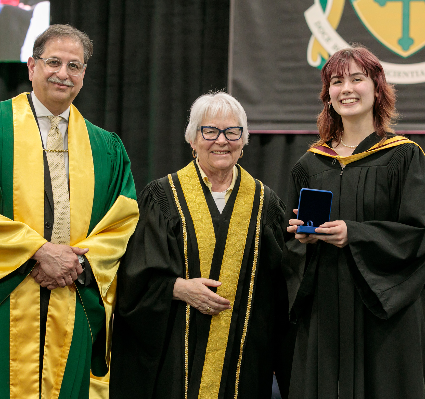 President Farooqi and the Lieutenant Governor of New Brunswick Louise Imbeault present the Governor General's Medal to Beatrix Culligan at Spring Convocation