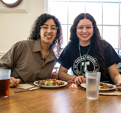 Students sitting at dining table