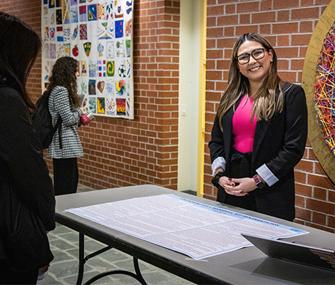 Female student presenter at SRIF 2024 poster presentation