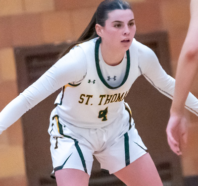 photo of a female Tommies basketball player on the court