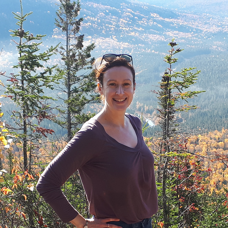 A student standing in front of a view