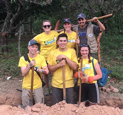 Photo of student abroad working as part of Global Brigades