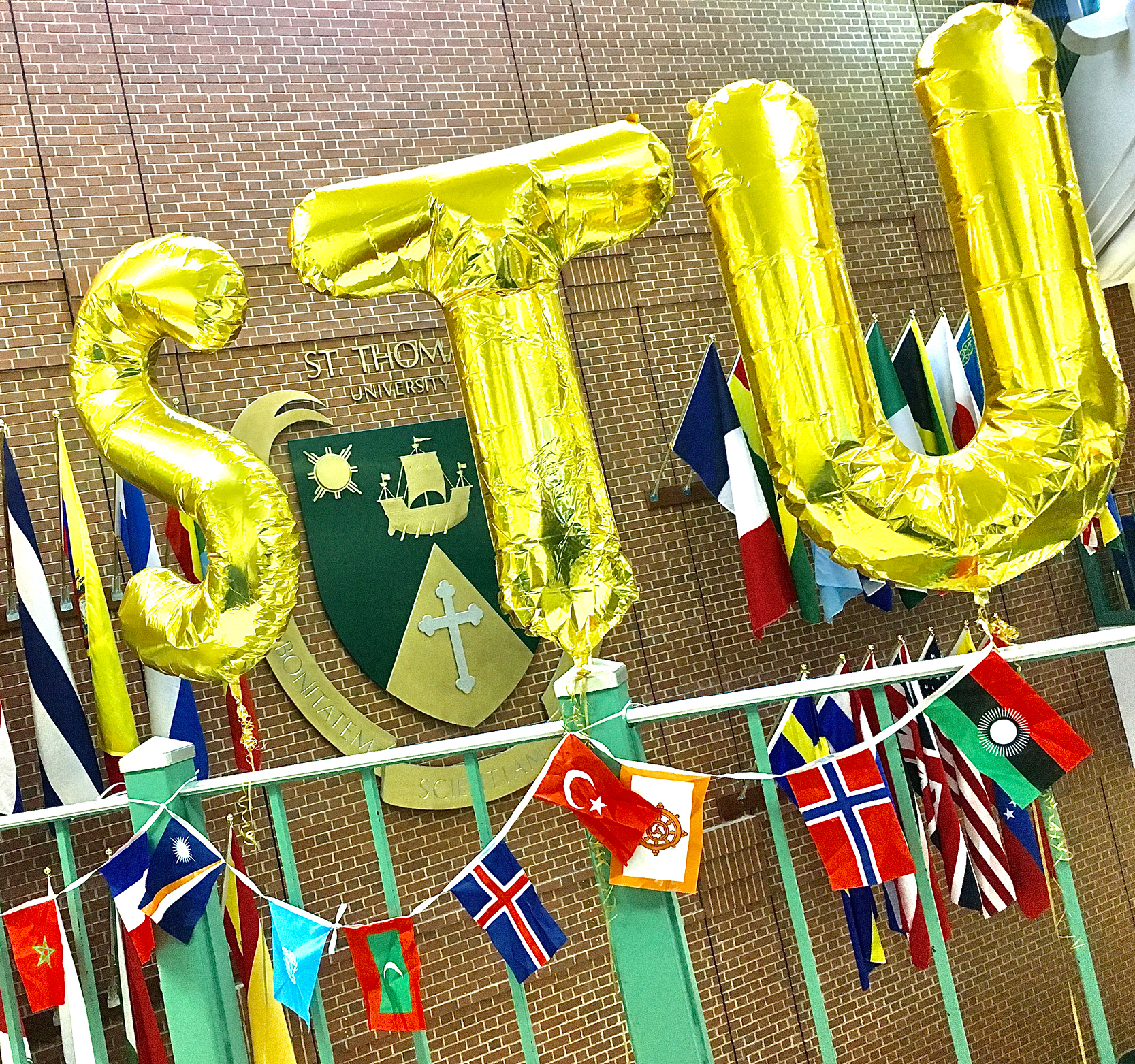 Photo of STU balloons and international flags in Sir James Dunn Hall