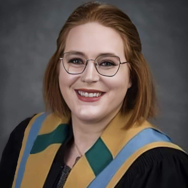 A student grad photo in BEd hood