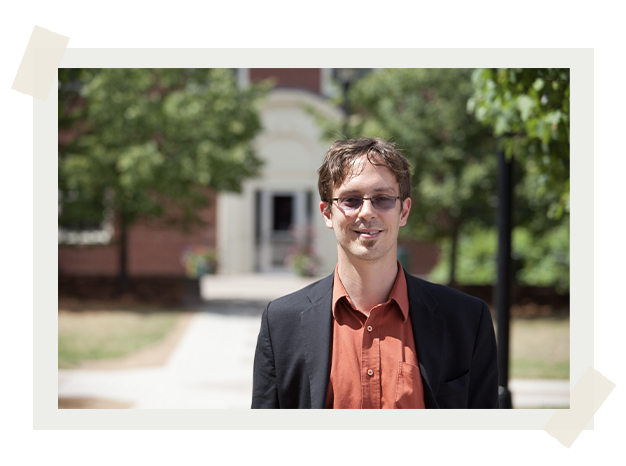 Dr. Matte Robinson standing in front of Holy Cross House