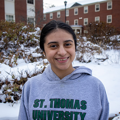 Student Kensy Alonso smiling on campus